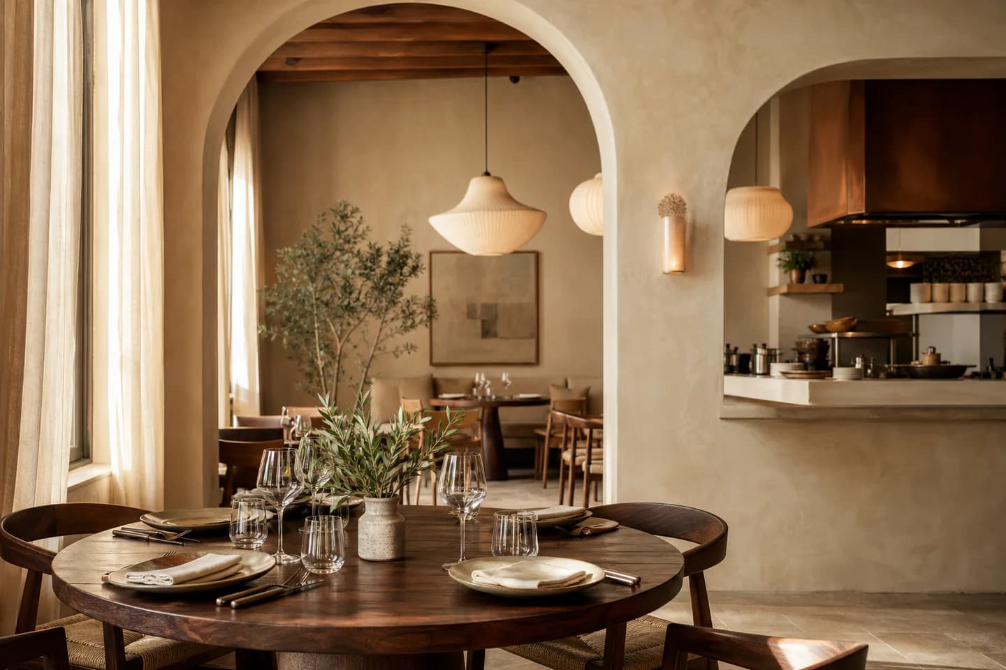 Warm Mediterranean dining room with arched walls and walnut tables